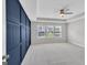 Spacious bedroom with gray carpet, trey ceiling and a decorative navy wall at 2060 Lanier Harbor Pt, Buford, GA 30518