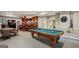Basement rec room with a bar area, pool table, and seating at 770 Spalding Heights Dr, Atlanta, GA 30350
