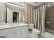Neutral patterned bathroom with shower and single vanity at 770 Spalding Heights Dr, Atlanta, GA 30350