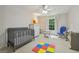 Bright, neutral Bedroom featuring a grey crib, and plenty of space and natural light at 770 Spalding Heights Dr, Atlanta, GA 30350