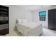 Cozy bedroom featuring a queen-sized bed, neutral walls and carpet, and a built-in bookshelf at 770 Spalding Heights Dr, Atlanta, GA 30350