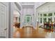 Grand foyer with soaring ceilings, hardwood floors, and elegant architectural details at 770 Spalding Heights Dr, Atlanta, GA 30350