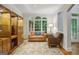 Cozy living room with large windows, fireplace, and comfortable seating at 770 Spalding Heights Dr, Atlanta, GA 30350
