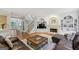 Open-concept living room with fireplace, built-in shelving, and hardwood floors at 770 Spalding Heights Dr, Atlanta, GA 30350