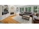 Spacious living room with fireplace, built-in shelving, and large windows at 770 Spalding Heights Dr, Atlanta, GA 30350