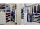 Walk-in closet features custom shelving and ample storage for clothing, shoes, and accessories at 770 Spalding Heights Dr, Atlanta, GA 30350
