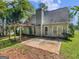 View of the patio area in the backyard, with a pergola, mature trees and privacy at 404 Northwind Pl, Stockbridge, GA 30281