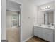 Double vanity in en-suite bathroom with tile flooring and view of bedroom at 404 Northwind Pl, Stockbridge, GA 30281