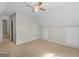 Neutral bedroom features a ceiling fan, plush carpeting, and an access panel at 404 Northwind Pl, Stockbridge, GA 30281