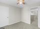 Bedroom with neutral carpet, ceiling fan, and access to the upper level hallway at 404 Northwind Pl, Stockbridge, GA 30281