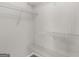 Walk-in closet with built-in shelving, ready for organized storage at 404 Northwind Pl, Stockbridge, GA 30281