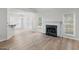 An open concept living room with a bar and a beautiful fireplace at 404 Northwind Pl, Stockbridge, GA 30281