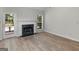 Bright living room with a marble fireplace and access to the backyard at 404 Northwind Pl, Stockbridge, GA 30281