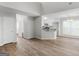 Spacious living room with hardwood floors adjacent to kitchen and dining area at 404 Northwind Pl, Stockbridge, GA 30281