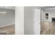 Open living room featuring hardwood floors and a charming fireplace at 404 Northwind Pl, Stockbridge, GA 30281
