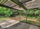 Covered pergola and patio area offering shade and a view of the natural surroundings at 404 Northwind Pl, Stockbridge, GA 30281