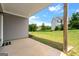 Covered back patio providing a relaxing outdoor space with a view of the expansive lawn at 4105 Vista Pointe Dr, Cumming, GA 30028