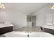 Large bathroom featuring a glass shower, soaking tub, dual vanities and tile floors at 4105 Vista Pointe Dr, Cumming, GA 30028