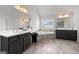 Spacious bathroom featuring dual vanities, a soaking tub, and tile floors at 4105 Vista Pointe Dr, Cumming, GA 30028