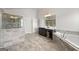 Large bathroom featuring a glass shower, soaking tub, dual vanities and tile floors at 4105 Vista Pointe Dr, Cumming, GA 30028