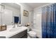 Bathroom with white tub and shower and dark cabinets at 4105 Vista Pointe Dr, Cumming, GA 30028