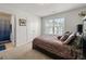 Bedroom with large window, walk-in closet, and carpet at 4105 Vista Pointe Dr, Cumming, GA 30028
