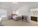 Well-lit bedroom with a neutral color scheme, including an ensuite bathroom at 4105 Vista Pointe Dr, Cumming, GA 30028