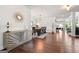 Elegant dining area with hardwood floors, a modern buffet, a stylish table, and ample seating for entertaining at 4105 Vista Pointe Dr, Cumming, GA 30028