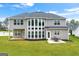 Home with a sprawling backyard, perfect for entertaining or relaxation on the spacious patio at 4105 Vista Pointe Dr, Cumming, GA 30028