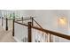 Second floor hallway with wooden railing and view of backyard at 4105 Vista Pointe Dr, Cumming, GA 30028