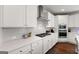 Elegant kitchen with white countertops, stainless steel appliances, modern backsplash, and ample cabinet space at 4105 Vista Pointe Dr, Cumming, GA 30028