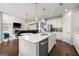 Bright, open-concept kitchen with a large island, stainless steel appliances, and hardwood floors at 4105 Vista Pointe Dr, Cumming, GA 30028