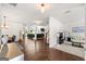 Spacious open-concept living area with gleaming hardwood floors and abundant natural light from large windows at 4105 Vista Pointe Dr, Cumming, GA 30028