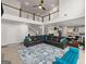 Living area with a view of the upper level, modern furniture, and an open floor plan with hardwood floors at 4105 Vista Pointe Dr, Cumming, GA 30028
