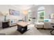 Bright living room with plush carpet, stylish furnishings, and large windows providing picturesque outdoor views at 4105 Vista Pointe Dr, Cumming, GA 30028