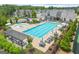 Community swimming pool with lounge chairs and umbrellas, perfect for relaxation and summer fun at 4105 Vista Pointe Dr, Cumming, GA 30028