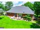 Brick home with a well-kept lawn and beautiful landscaping in a suburban setting at 109 National Way, Carrollton, GA 30116