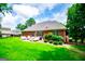 Spacious green lawn and tree-lined backyard of a brick home at 109 National Way, Carrollton, GA 30116
