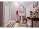 Cozy bathroom featuring a pedestal sink, glass-enclosed shower, and decorative accents at 109 National Way, Carrollton, GA 30116