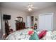 Bedroom with ceiling fan, tv, closet and ensuite bathroom at 109 National Way, Carrollton, GA 30116