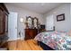 Cozy bedroom featuring wood floors, ceiling fan, and a furniture at 109 National Way, Carrollton, GA 30116