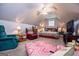 Attic bedroom features vaulted ceilings, ceiling fan, and a sitting area at 109 National Way, Carrollton, GA 30116