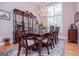 Dining room featuring a formal dining table, elegant chandelier, and large window at 109 National Way, Carrollton, GA 30116