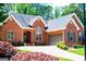Beautiful brick home boasting a two-car garage, well-maintained landscaping, and an inviting entrance at 109 National Way, Carrollton, GA 30116