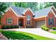 Charming brick home featuring an attached garage, neatly trimmed bushes, and lovely curb appeal at 109 National Way, Carrollton, GA 30116