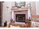 Close-up view of the fireplace with brick surround and white mantle, adding character to the living space at 109 National Way, Carrollton, GA 30116