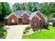 Charming brick home with well-manicured landscaping, a spacious driveway, and welcoming curb appeal at 109 National Way, Carrollton, GA 30116