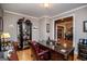 Well-appointed home office with a large desk, display cabinet, and classic furnishings for a professional workspace at 109 National Way, Carrollton, GA 30116