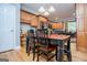 View of a kitchen with wood cabinetry and a table and chairs, and wood-look flooring at 109 National Way, Carrollton, GA 30116