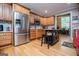 Kitchen with stainless steel appliances, wood cabinetry and a kitchen island at 109 National Way, Carrollton, GA 30116